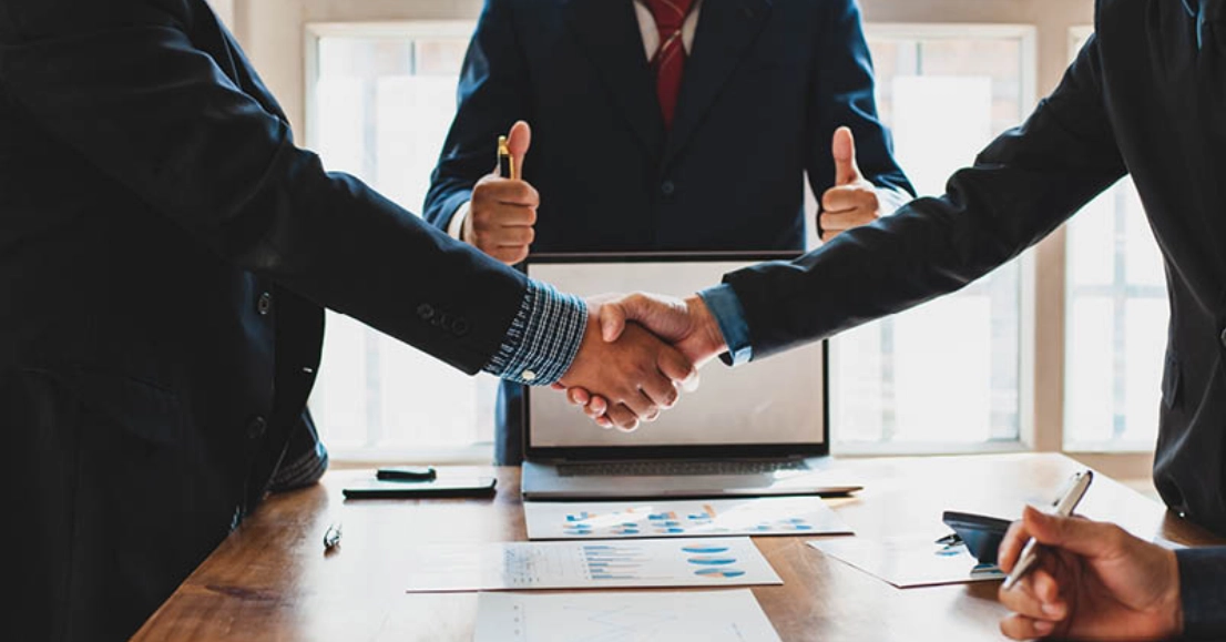 Construction dispute resolution meeting between project stakeholders reviewing contract and cost documentation